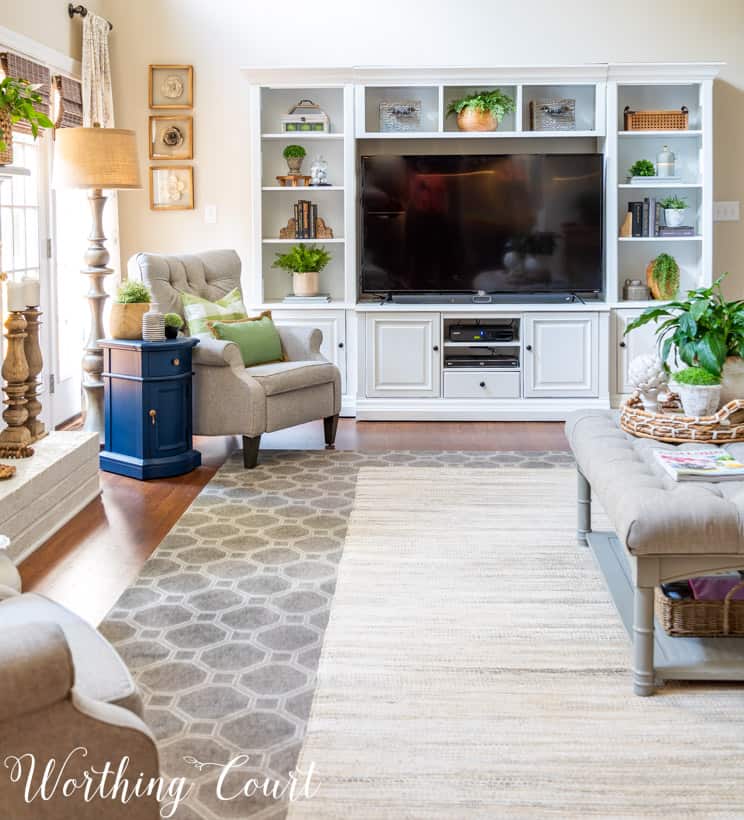 living room with white painted entertainment center and accessories