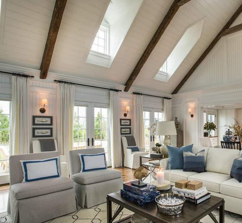 large living room with beams, chairs and sofa