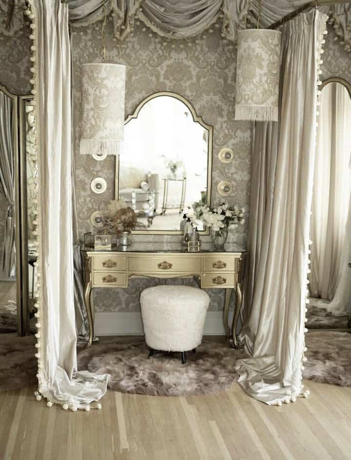 silver dressing table with mirror flanked by draperies