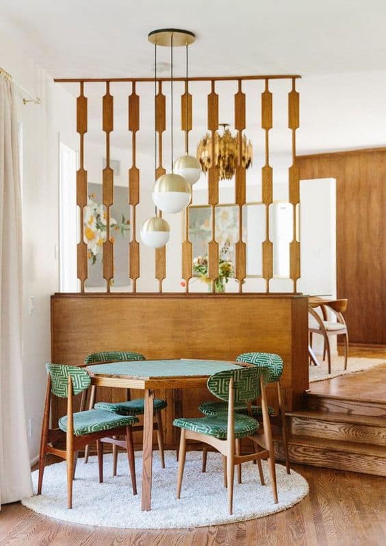 mid century modern dining set in front of room divider