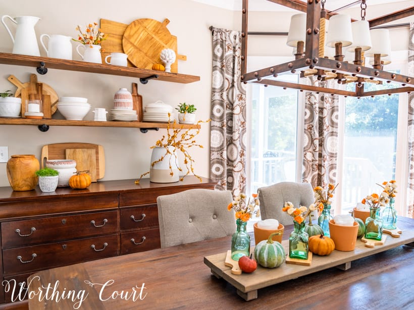 Dining area with opens shelves and fall decor