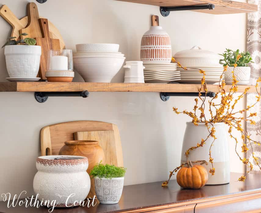 open shelves decorated for all with white dishes