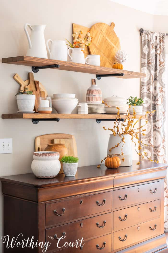 Dining area with opens shelves and fall decor