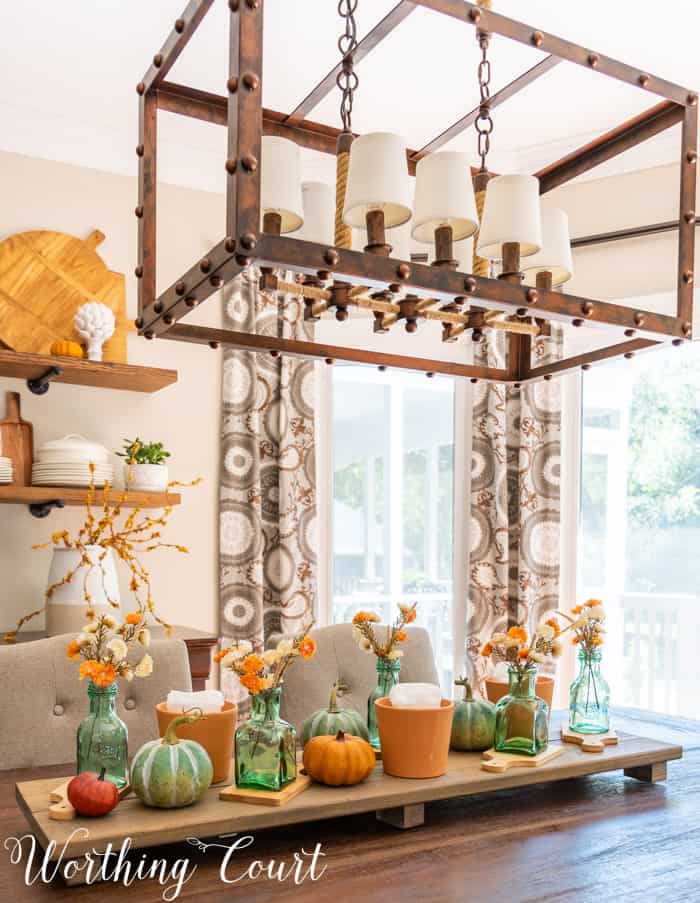 Dining area with opens shelves and fall decor