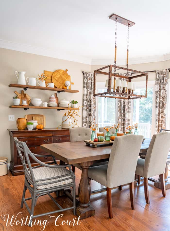Dining area with opens shelves and fall decor