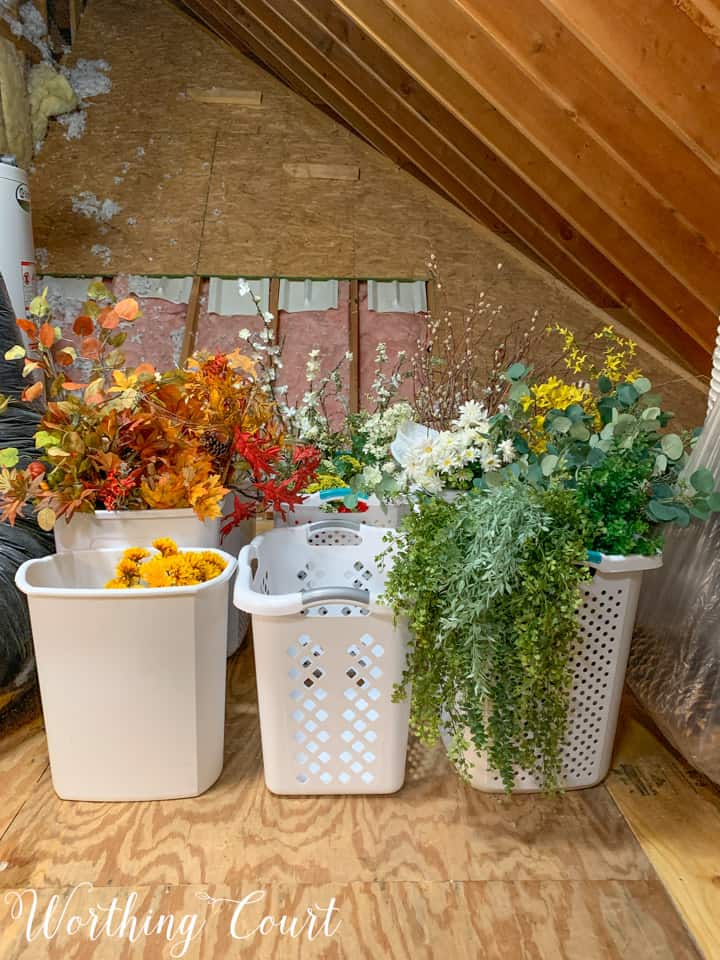 plastic garbage cans holding greenery stems