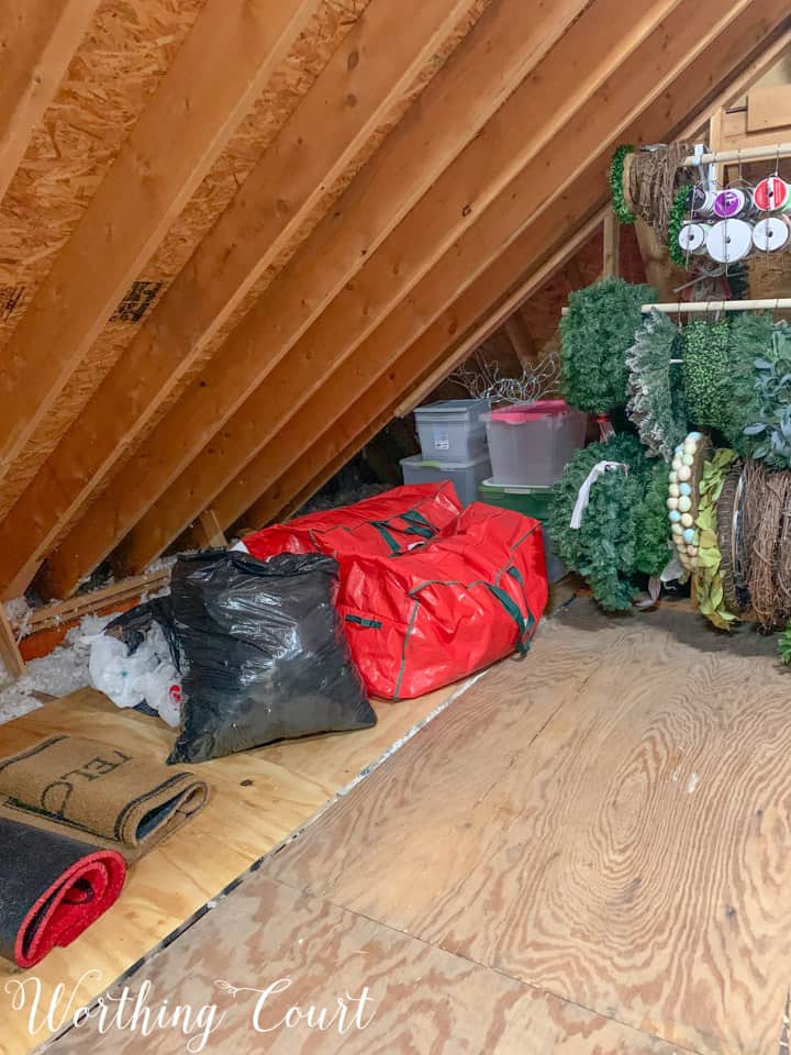 organized bins and bags in a walk in an attic