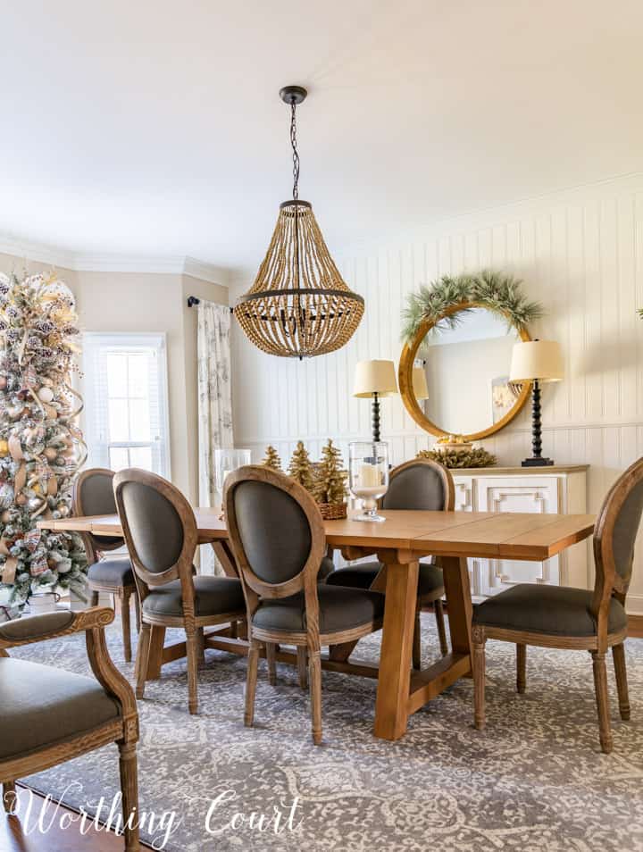 dining room table, chairs and sideboard decorated with neutral colors for Christmas