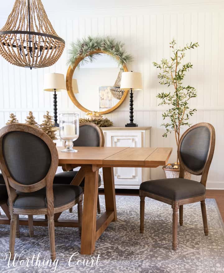 dining room table, chairs and sideboard decorated with neutral colors for Christmas