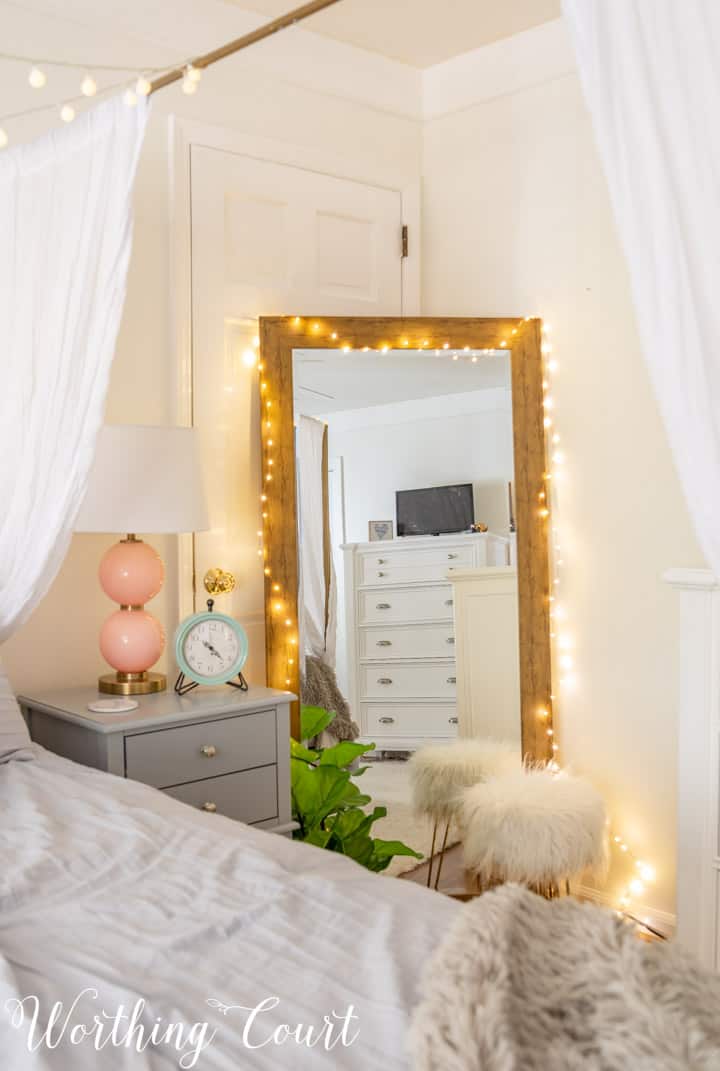 full length mirror draped with fairy lights