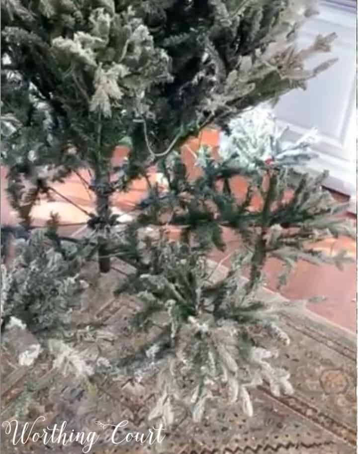 flocked artificial Christmas tree partially put together