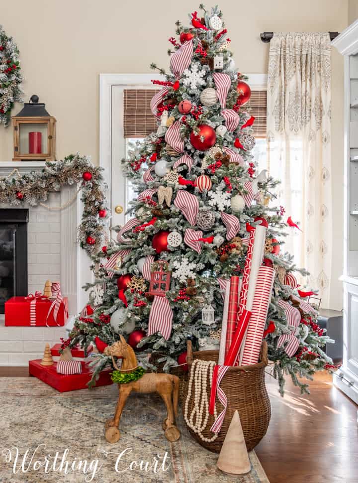 flocked Christmas tree with red and white decorations