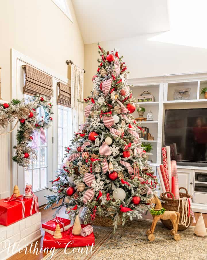 flocked Christmas tree with red and white decorations