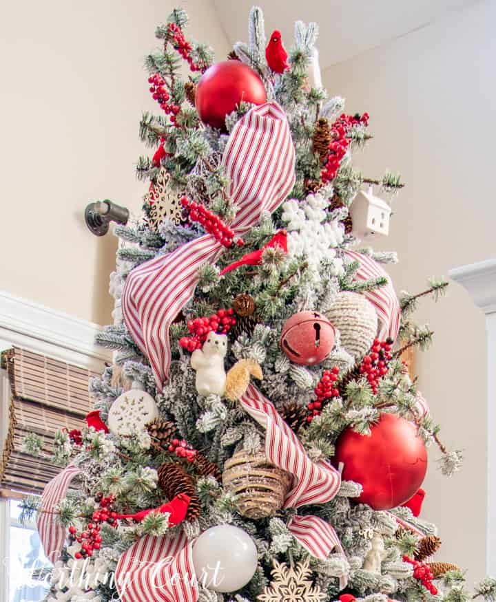 flocked Christmas tree with red and white decorations