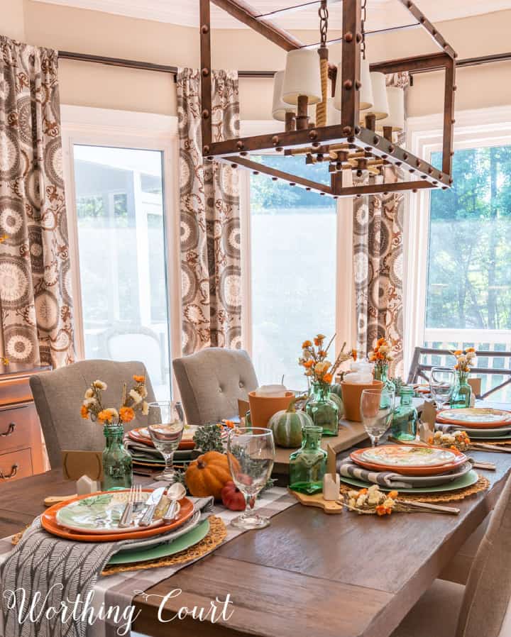 Thanksgiving table set with traditional fall colors and elements