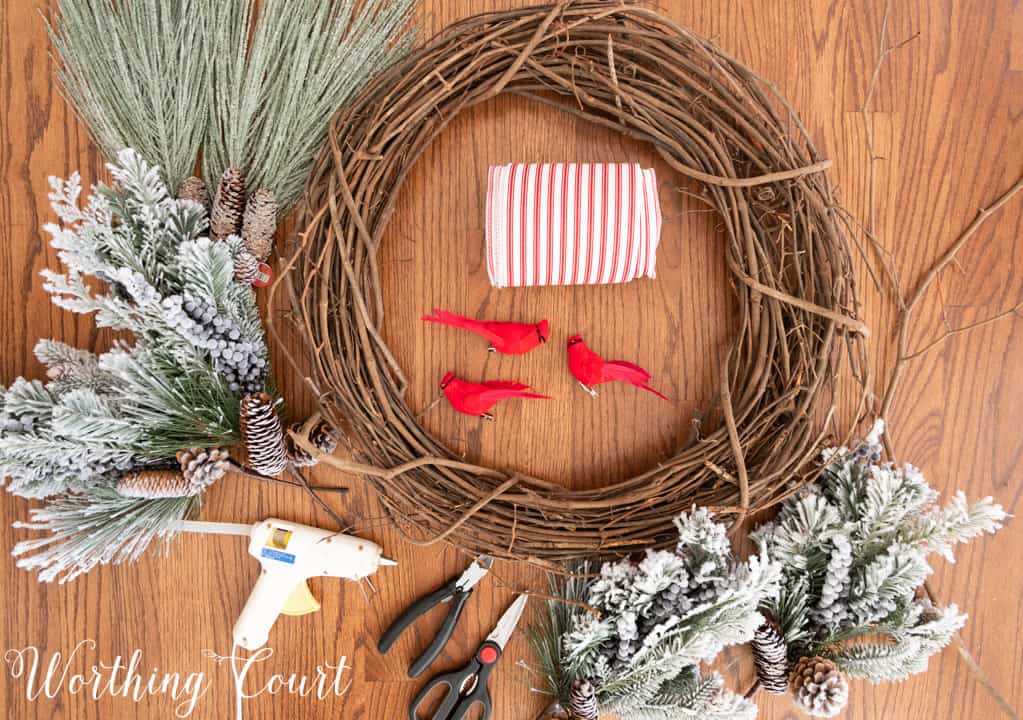 partially assembled Christmas wreath lying on a table