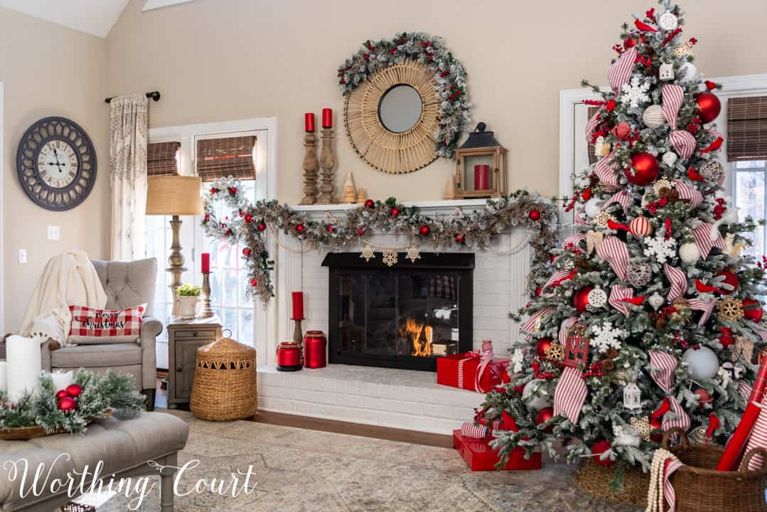 white fireplace with red and white Christmas decor