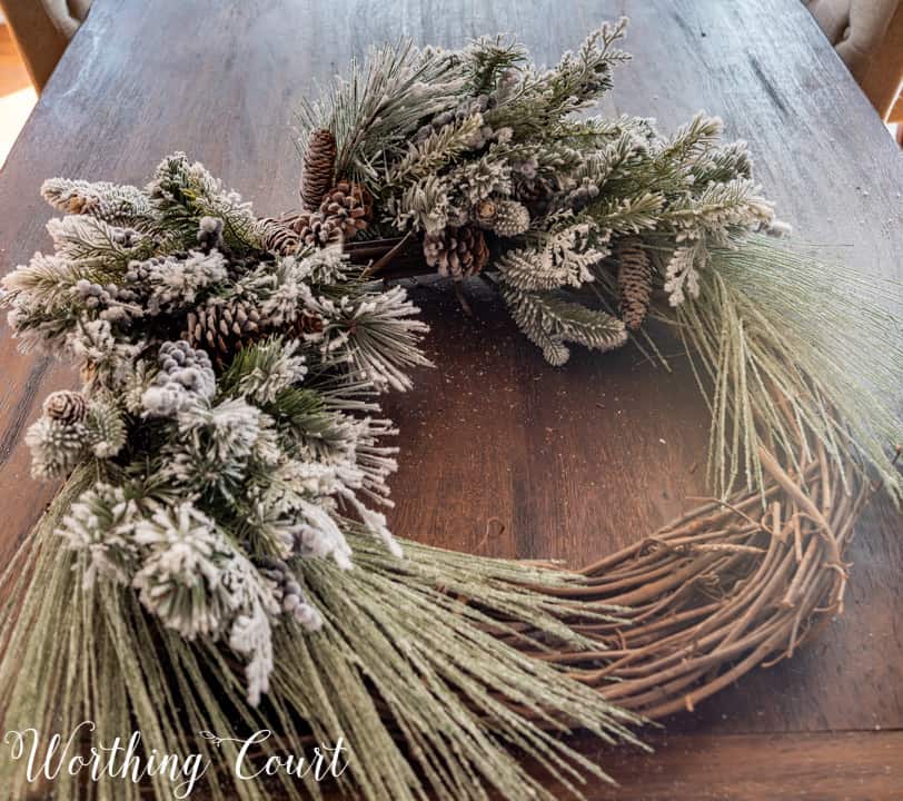 partially assembled Christmas wreath lying on a table