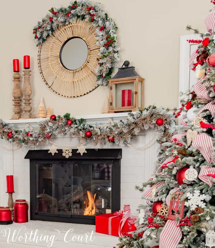 white fireplace with red and white Christmas decor