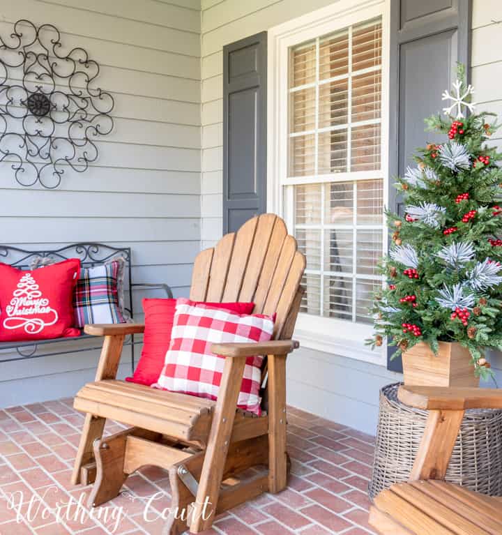 wooden Adirondack glider on porch