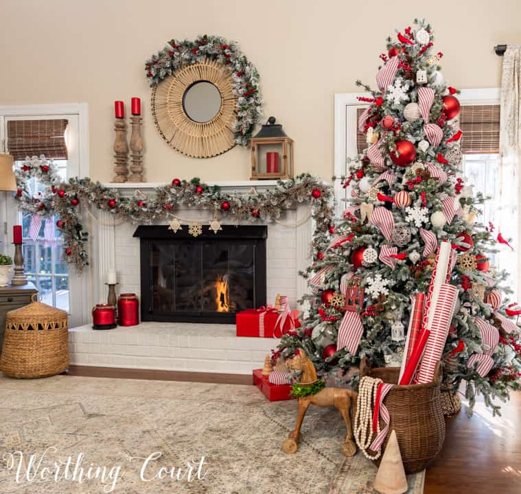 white fireplace with red and white Christmas decor
