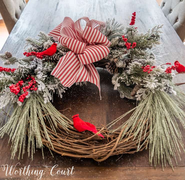 partially assembled Christmas wreath lying on a table