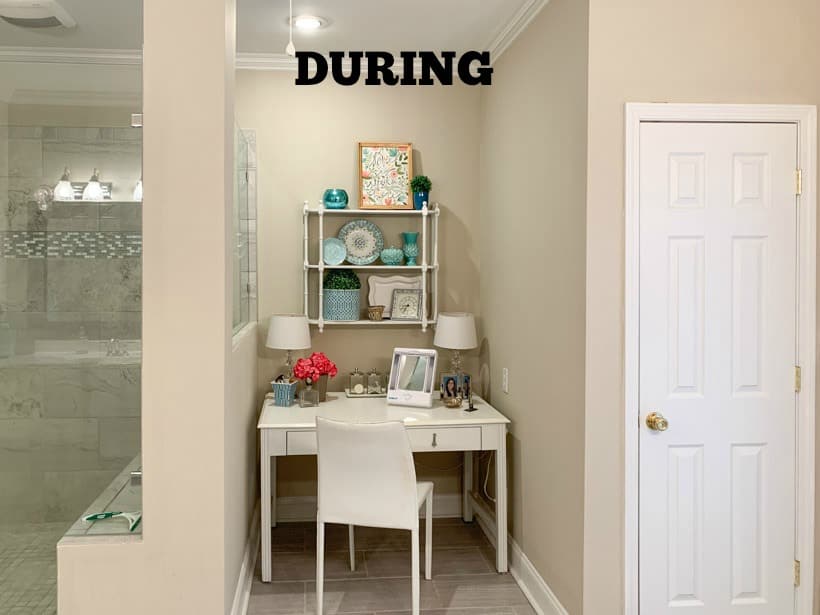 white dressing table with shelves above in a master bathroom