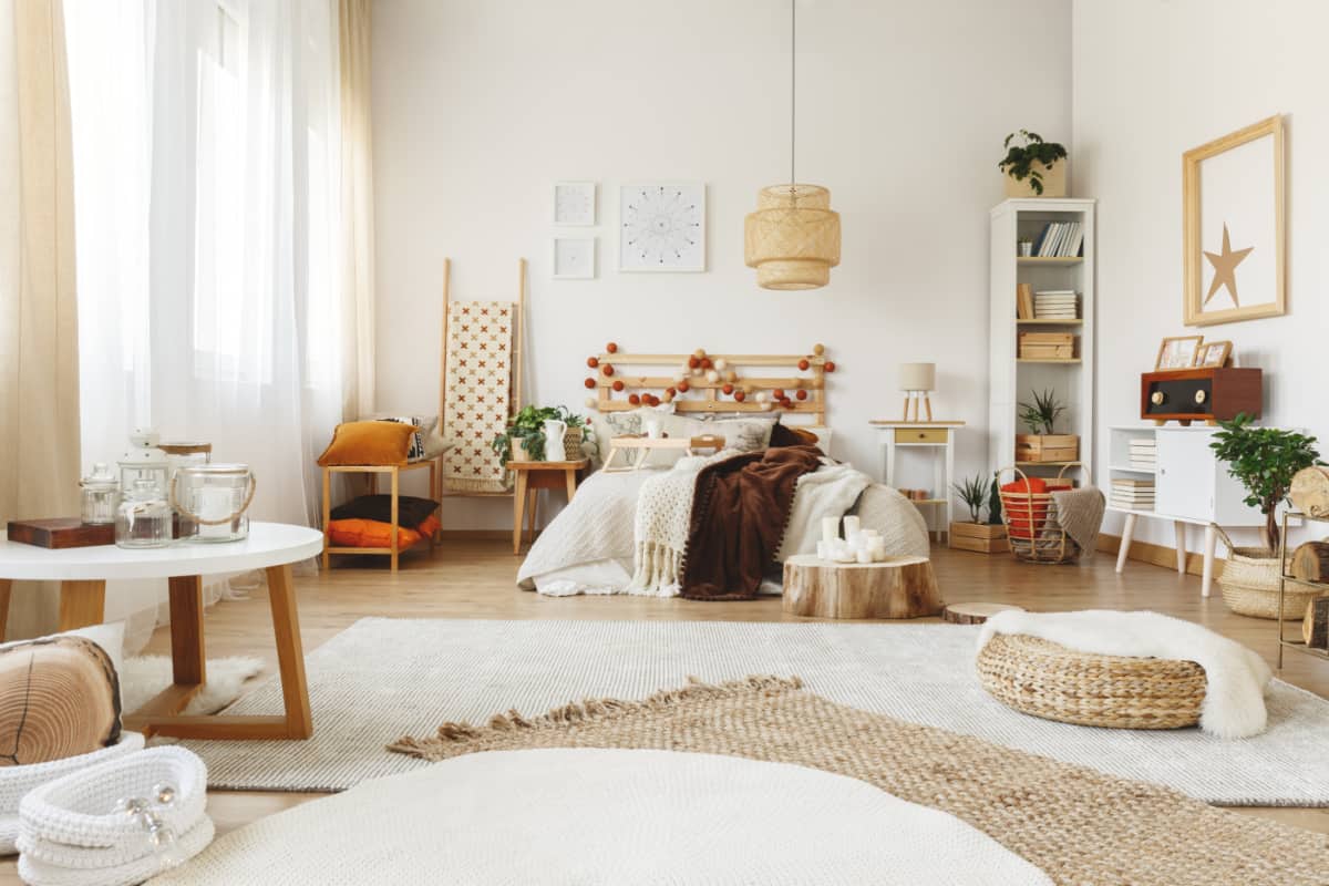 bedroom with neutral colored area rugs