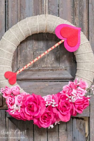 Valentine's wreath hanging on a wood shutter