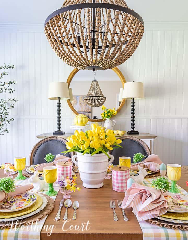 Easter tablescape using yellow dishes and faux flowers