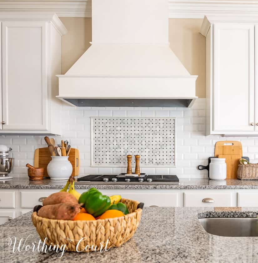 kitchen counter decorations against a white subway tile backsplash