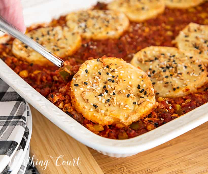 image of sloppy joe casserole topped with biscuits