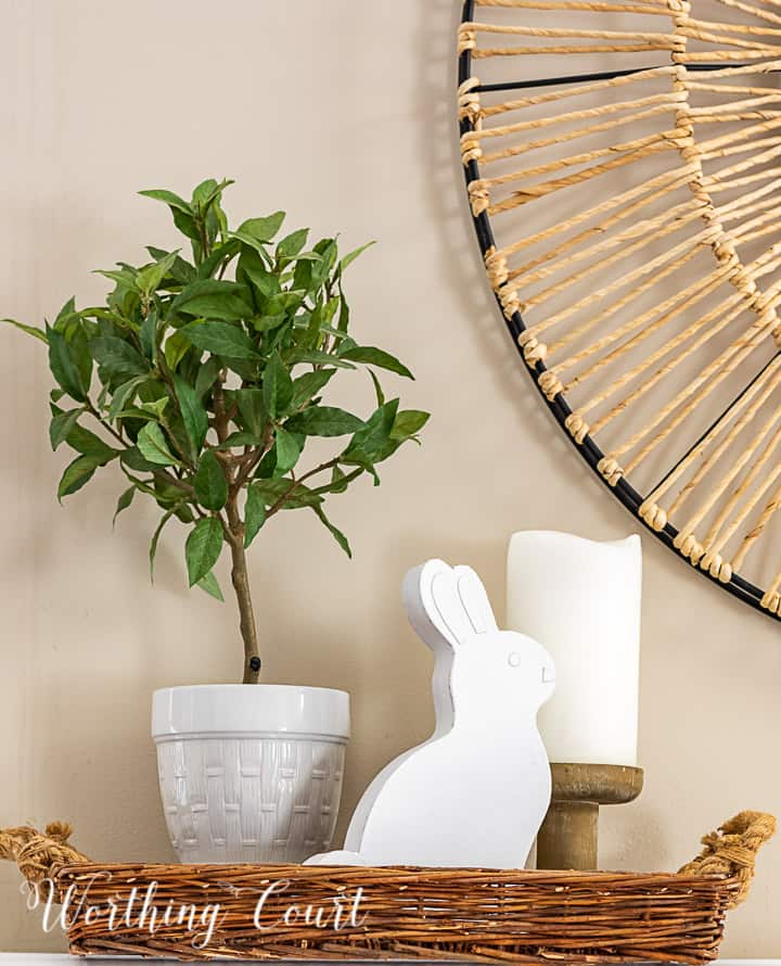 spring vignette in a tray with a topiary, candle and white bunny