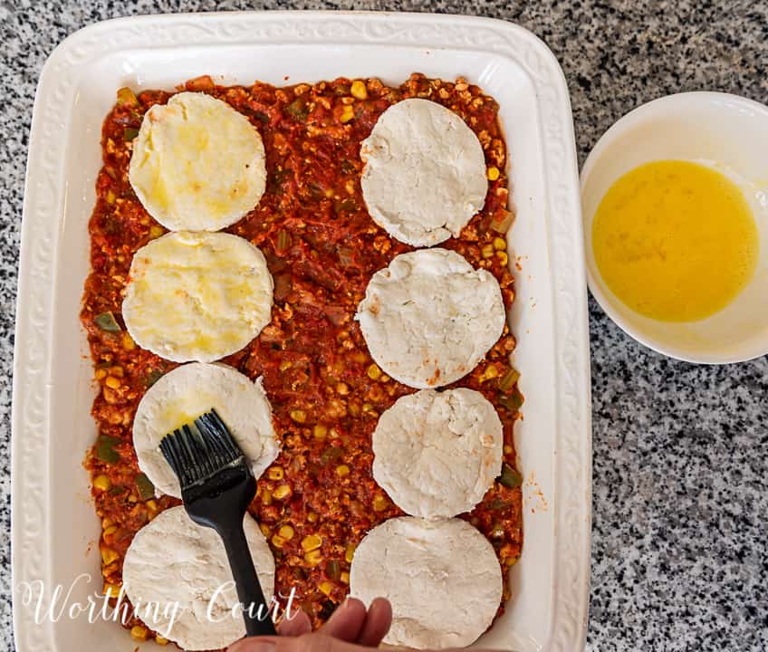 image of sloppy joe casserole topped with biscuits