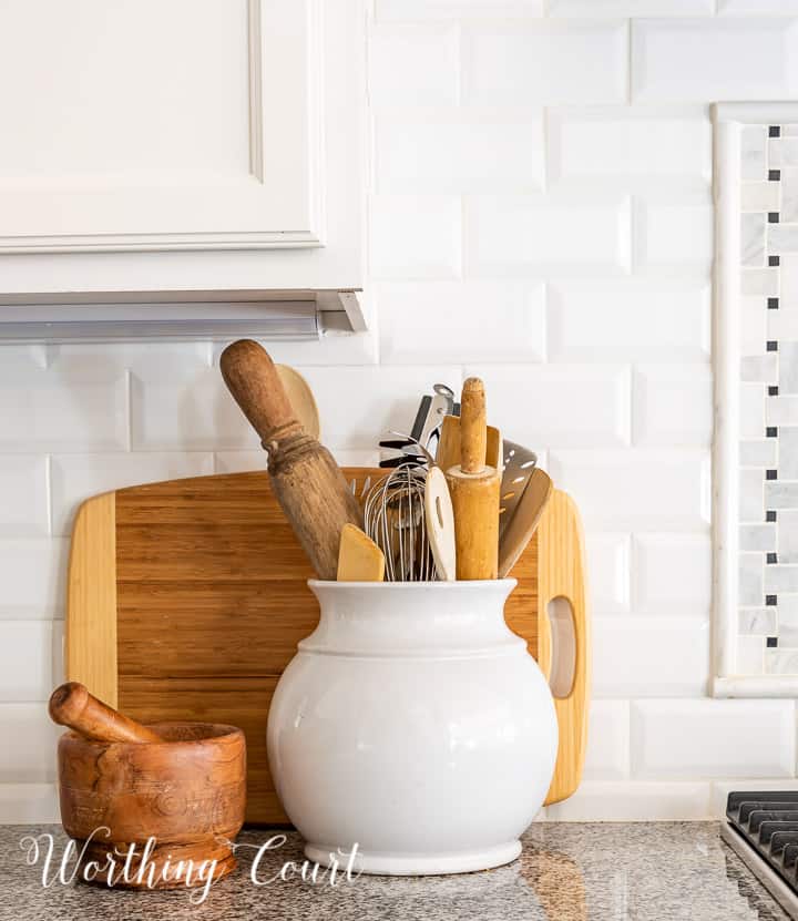 kitchen counter decorations against a white subway tile backsplash