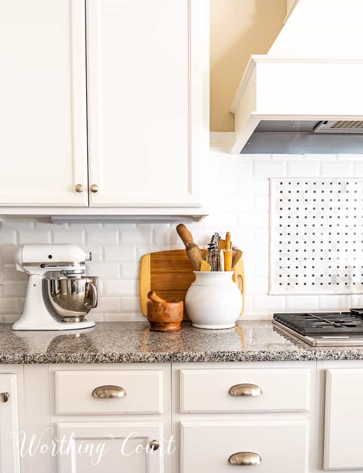 kitchen counter decorations against a white subway tile backsplash