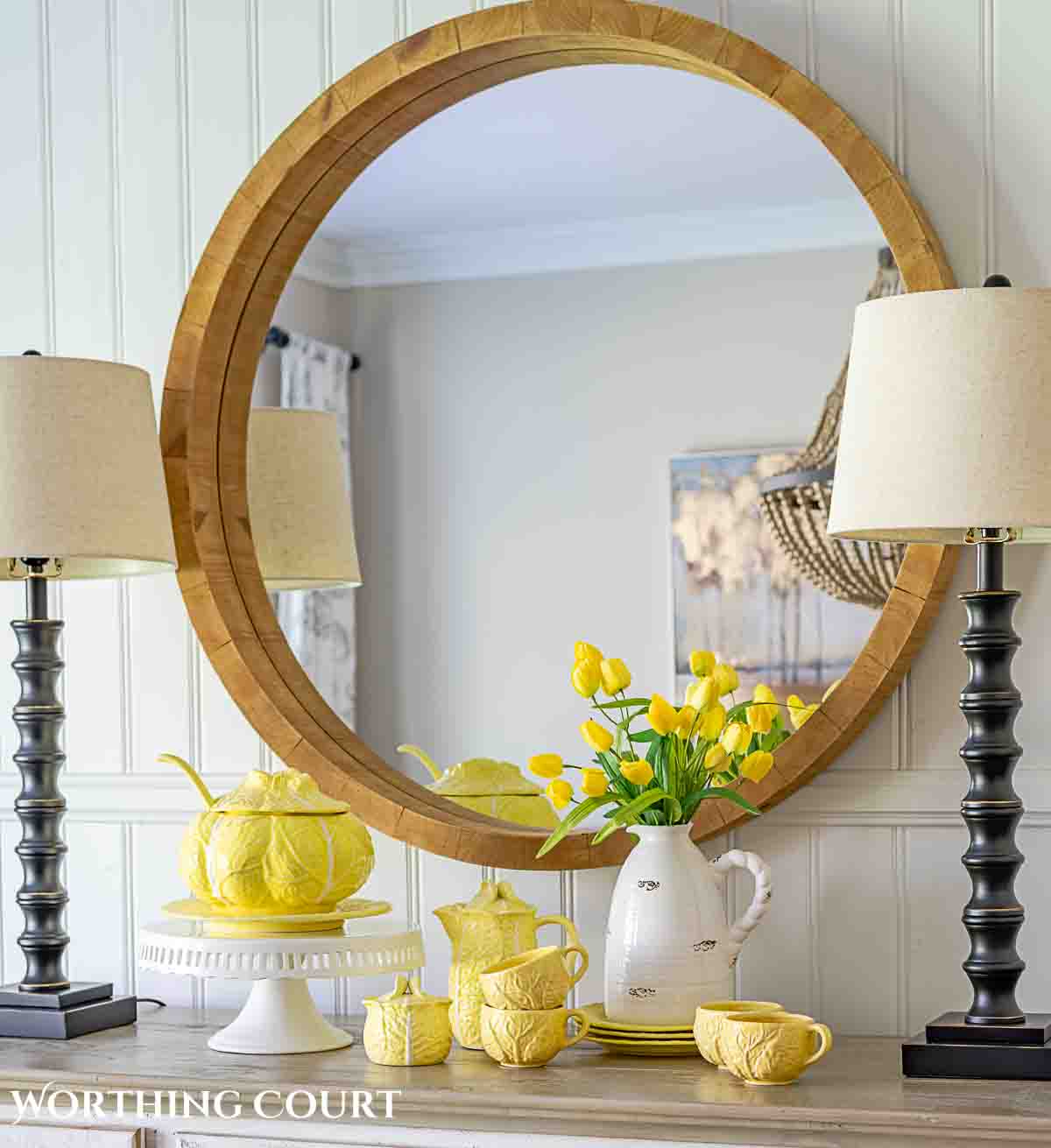 Yellow cabbage ware dishes on a white sideboard