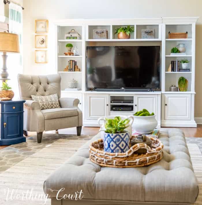 white entertainment center, chair and coffee table in a family room