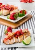 sliced grilled chicken breast topped with strawberry and pineapple salsa