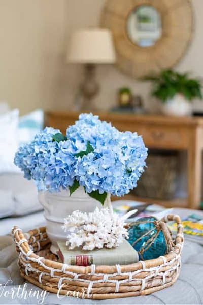 blue hydrangeas in a coffee table vignette
