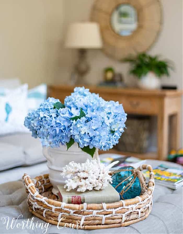 blue hydrangeas in a coffee table vignette