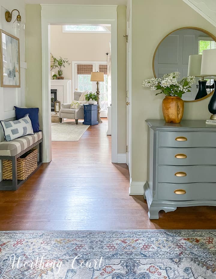 view from foyer looking into family room at chair in front of french door