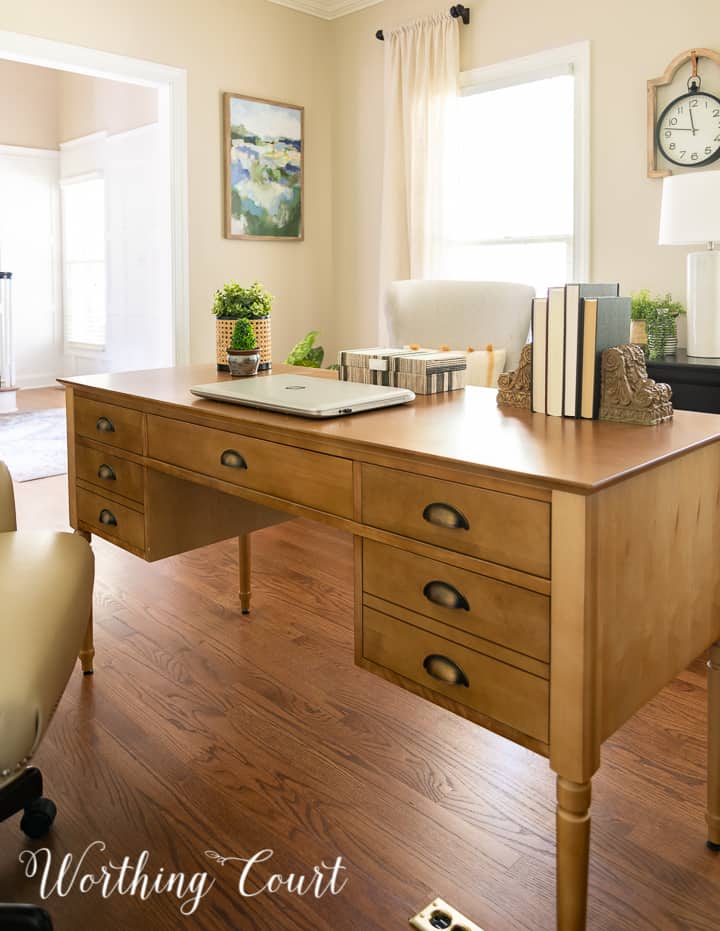 front of a natural wood toned desk