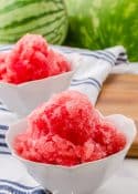 2 small white bowls filled with watermelon sorbet