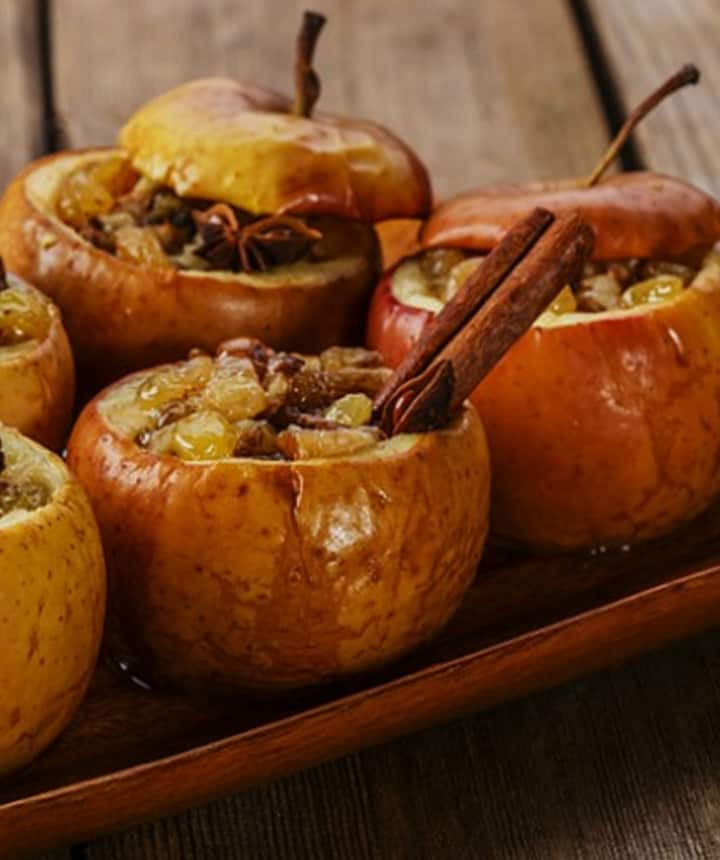 baked apples on a wood serving platter