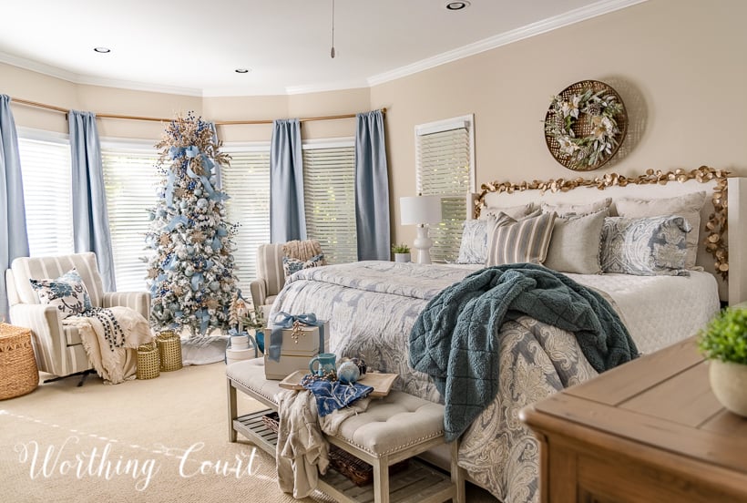 master bedroom decorated for Christmas with blue and gold decorations