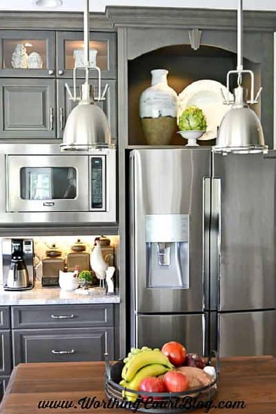 gray kitchen cabinets with stainless steel appliances