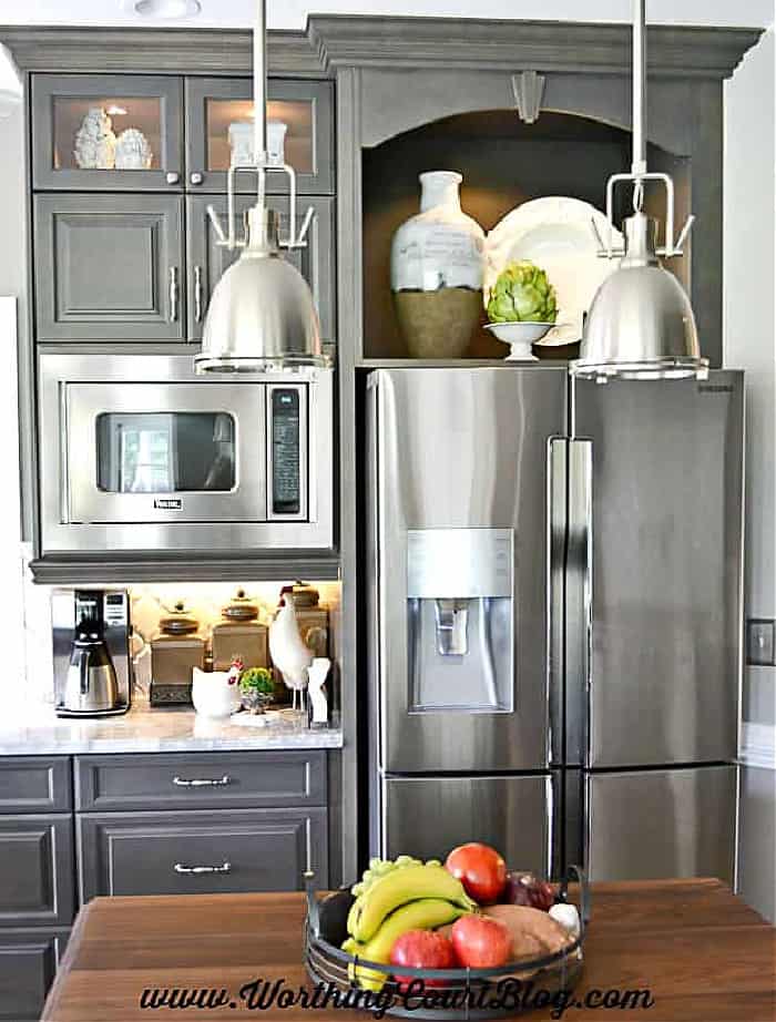 gray kitchen cabinets with stainless steel appliances