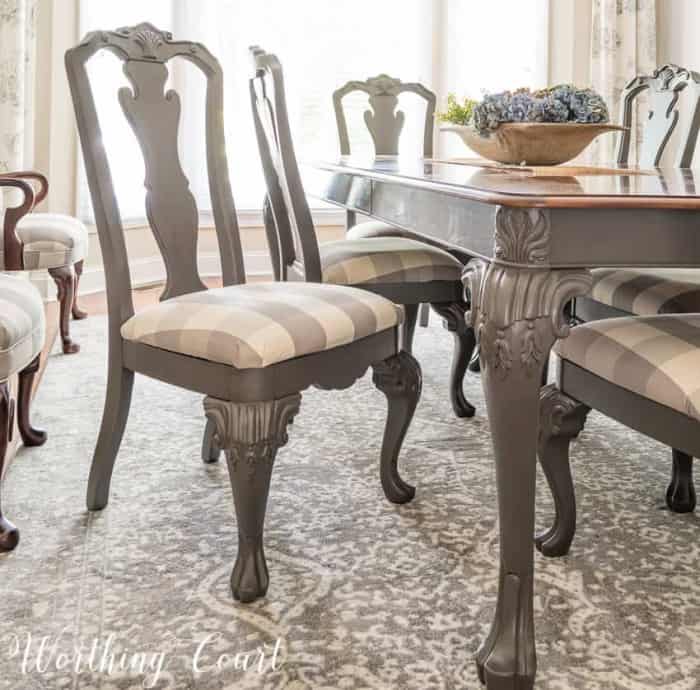 gray dining room chair with gray and white buffalo check fabric seat