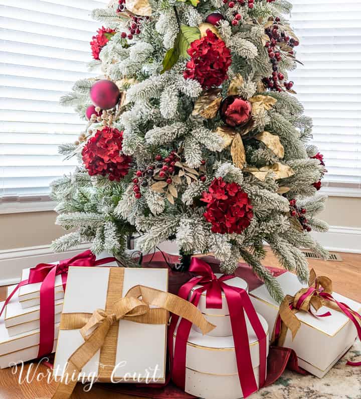 gold and burgundy decorations on a Christmas tree